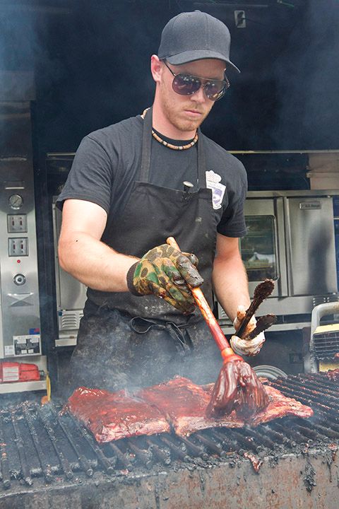 Dillon Prisner of the Ribs Royale Vegas team works to ensure the very best of their product is ready for the judging competition at Chatham's Ribfest on Saturday, July 6, 2013.