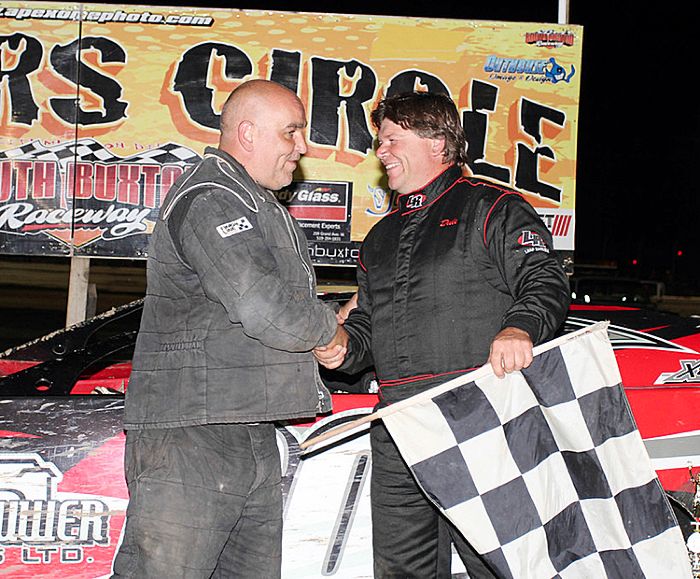 James MacDonald/South Buxton Raceway Ridgetown's Dale Glassford, right, shakes hands with second-place Mike Lewis of Wallaceburg.