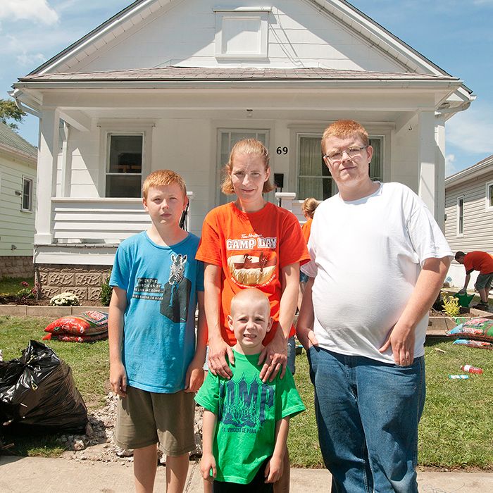Liz Huff and her three sons Zach, far left, Mason, centre, and Tim received a Backyard Mission home makeover several years ago.