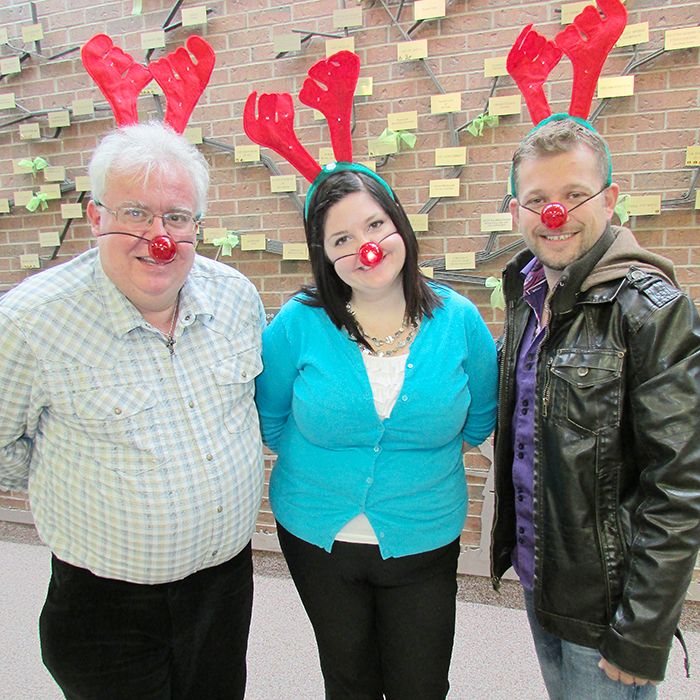 Chatham-Kent Children’s Treatment Centre Foundation executive director Art Stirling, left, and fundraising co-ordinator Candice Jeffrey try on the reindeer nose and antlers with Reindeer Run organizer Ben Labadie.