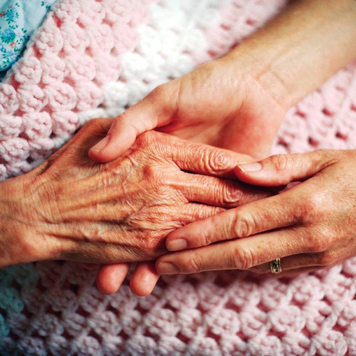 Holding Hands with Elderly Patient