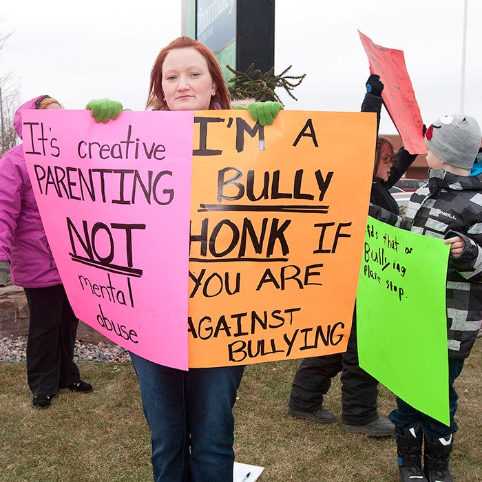 Kandyce Burchiel stands on the corner of Park Avenue and Lacroix Street in Chatham with her eight-year-old son, Connor Rushlow, and a team of supporters who received encouraging honks on Sunday afternoon following criticism from the Chatham-Kent Children’s Services.
