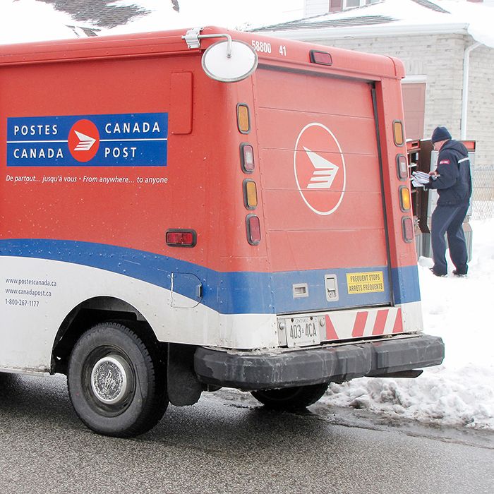 A Canada Post employee fills a super mailbox on Bristol Drive in Chatham recently. This will become a familiar site in urban areas in Chatham-Kent, and around the country, in the future. But just when it will take place locally is not yet known.