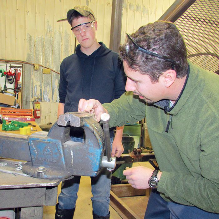 Rob Sterling, right, works with Brandon Crow to restore a scale-model John Deere tractor. Sterling and his father, Carl, are leaders for the 4-H Farm Toy Club, which operates out of Carl Sterling’s shop just north of Pain Court. The Sterlings are also the driving force behind the annual Chatham-Kent Toy Show & Sale, which takes place Jan. 19 at the John D. Bradley Convention Centre.