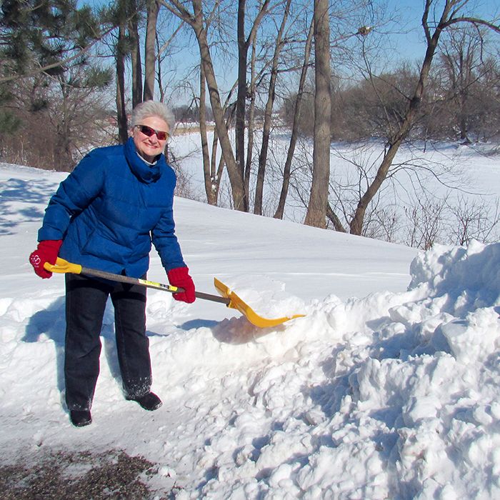 Bev Perrin, head of the Snow Angels in Chatham, clears away yet another shovelful of snow. Perrin, whose group helps seniors and shut ins keep their driveways and walkways clear in the winter, is short on volunteers.