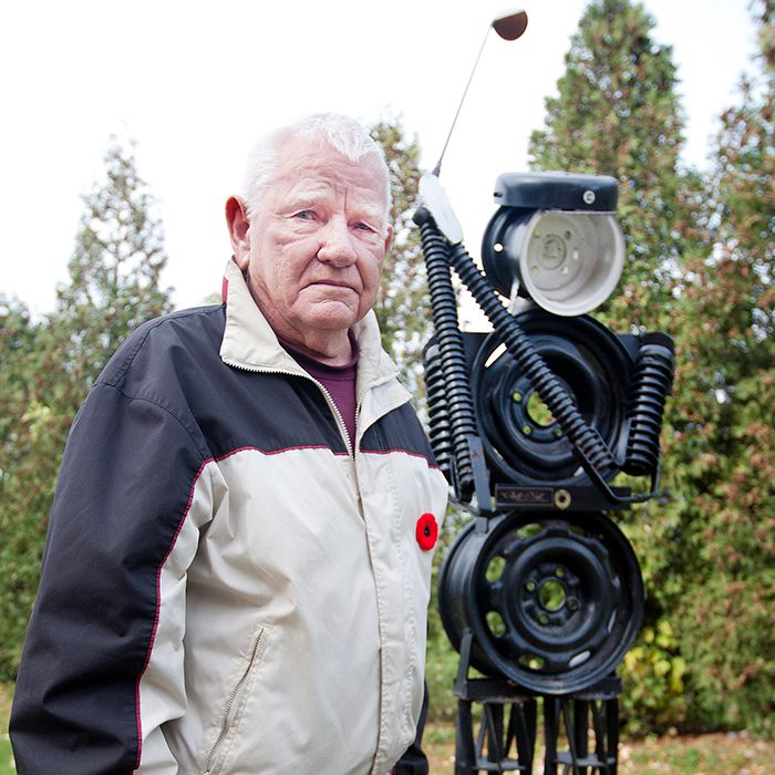 Bill Neff, 83, a former blacksmith and golf course owner, stands in front of the steel structure of a golfer he created a year ago at his son-in-law’s. Fondly calling it the “Iron Man,” the structure now sits permanently at the Southside Athletic Centre on Charing Cross Road where it was erected last spring.
