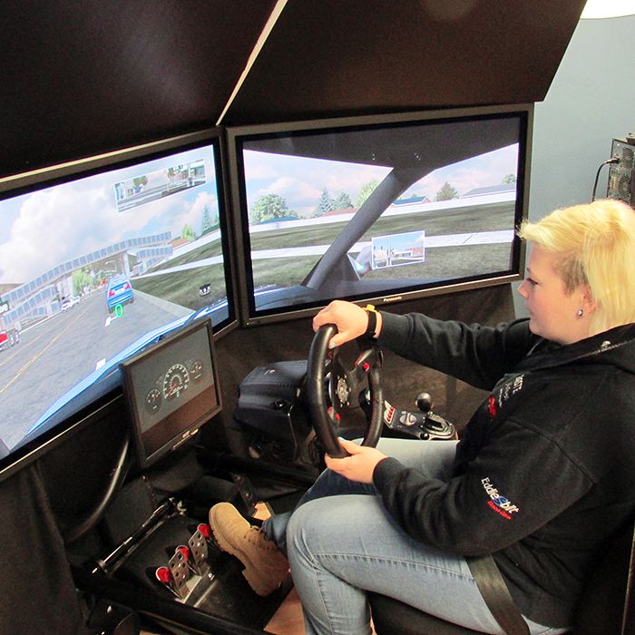 Julie Saunders tries out the driving simulator at DriveWise in Chatham. She will be taking a test for her G1 license later this year.