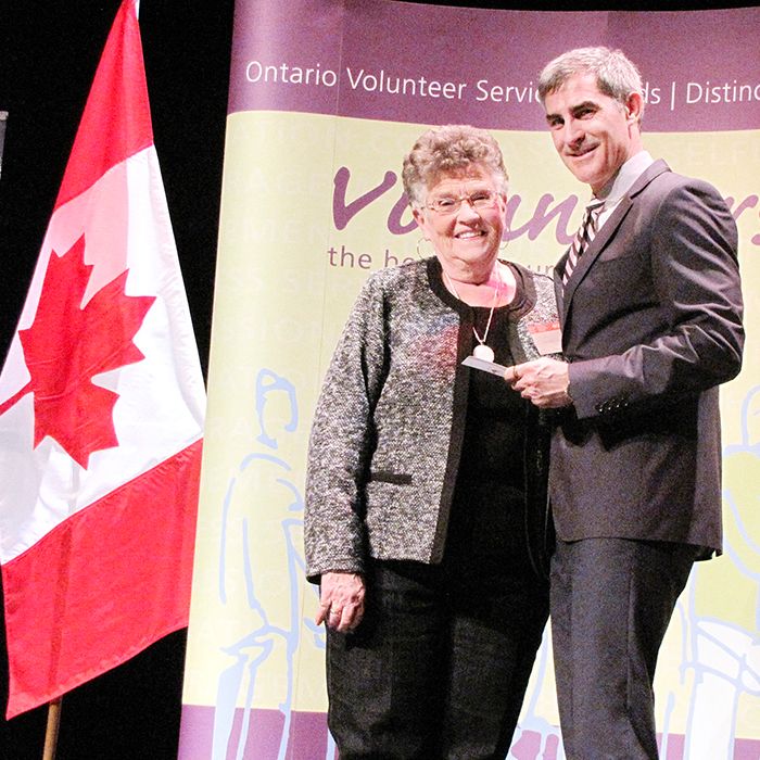 Dorothy Cook receives an Ontario Volunteer Service Award from Luc Vincent of the Ontario honours and awards secretariat from the Ministry of Citizenship and Immigration. Cook, who has volunteered for 40 years for Community Living, was one of 165 local volunteers that were recognized for their service in a ceremony held April 9 at the Capitol Theatre in Chatham.