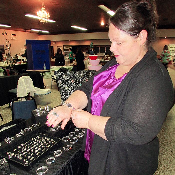 Kathy Anderson of Forks and Fashion showcases her unique hand-crafted jewelry made from silver flatware at the Shop Local Chatham Kent vendor event Fundraiser for Aubri on Saturday at Lawson Hall in Chatham.