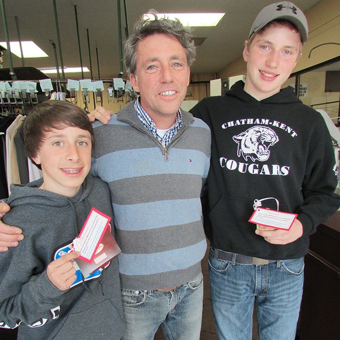 Grade 8 students Jake Hooker, left, and Brendan Bondy, right, asked family relative Michael Bondy of Bondy’s Cleaners to take part in their Kingdom assignment. He was given a $2 Tim’s card and asked to pay it forward. Bondy picked a day and paid for each customer’s bill.