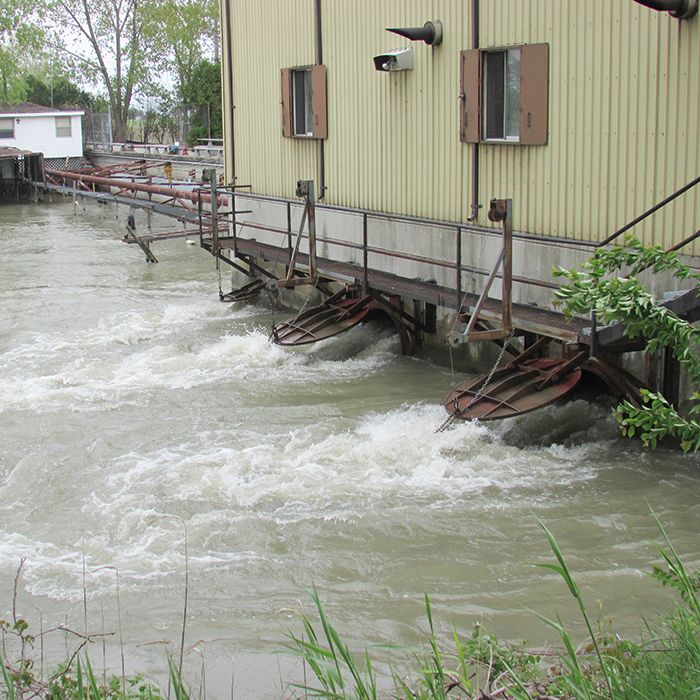 Water blasts from two outlets at the Rivard Line pumping station at a rate of 160,000 gallons per minute. The drainage scheme is the largest of its kind in Canada.