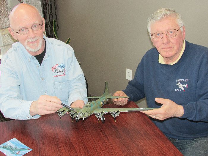 David Callanan and Norm Ellickson of the Yankee Air Museum examine a scale model of the B-17 Flying Fortress, a legendary Second World War bomber that will take to the skies over Chatham July 16. 