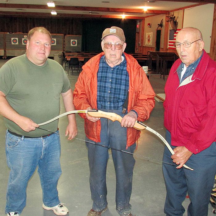 Bob Goodreau, Joe Pinsonneault and Vince Goodreau check out one of the bows used in the Dover Rod and Gun Club’s archery activities. Bob and Vince are charter members of the club, while Joe is the current president. The club was founded in 1949.