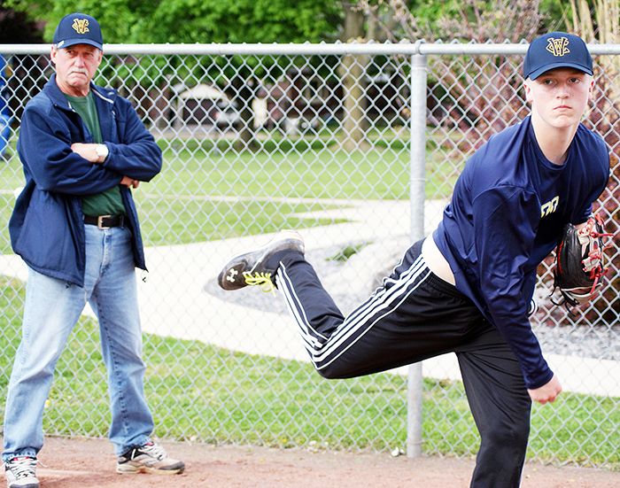 Bill Atkinson watches on as Wolverines pitcher Connor Goldsmith throws at Fergie Jenkins Field in Chatham.