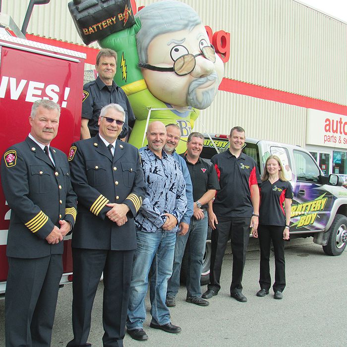 From left, Ken Stuebing, fire chief; Bob Davidson, assistant fire chief, Guy Deschenes (on truck), fire inspector; Peter Marshall, Canadian Tire Chatham; Doug Poulin, Canadian Tire Blenheim; Stan Pilecki, Canadian Tire Tilbury; and Paul and Kristie Card, Battery Boy, gathered June 12 to show their support from the 2014 Safe Homes Smoke Alarm Program.
