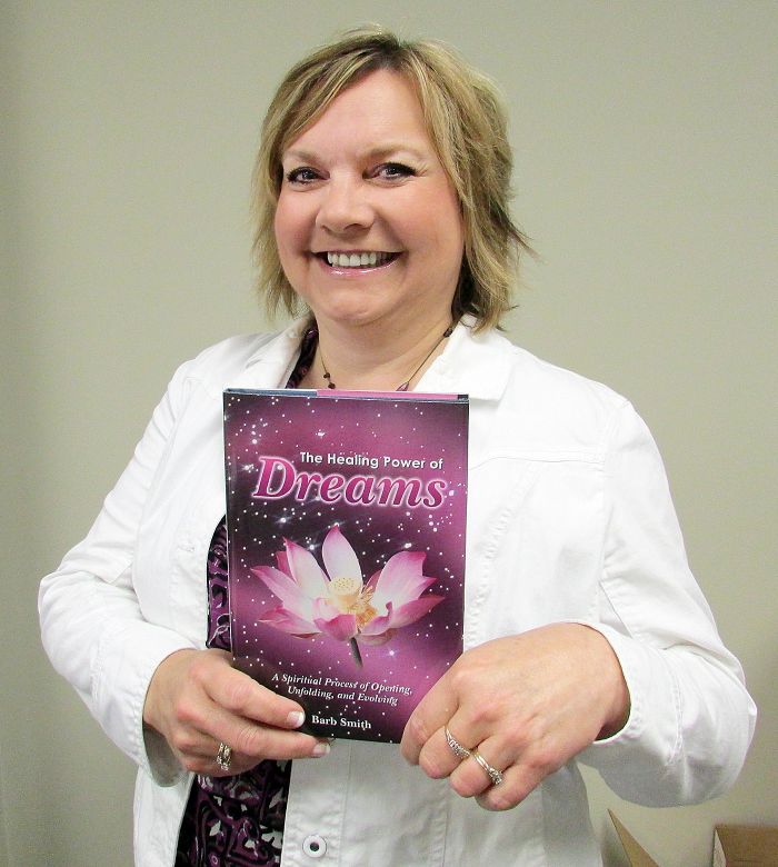 Mitchell's Bay resident Barb Smith shows off her new book, "The Healing Power of Dreams."