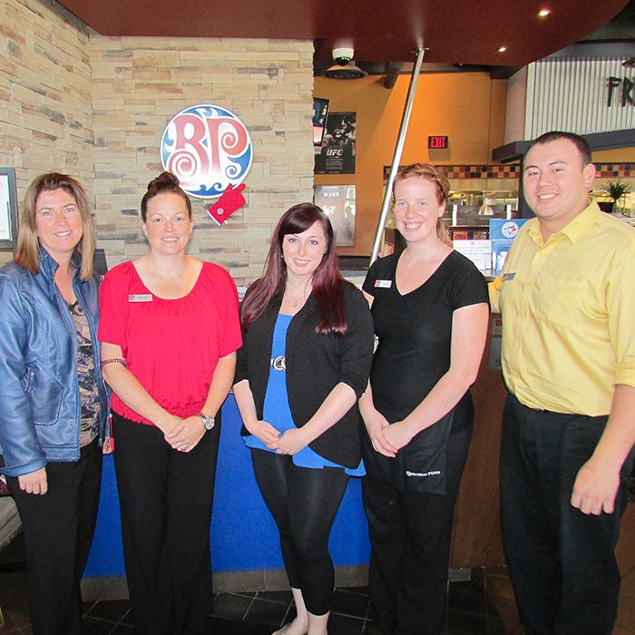 From left, Nathalie Sanson of the Conseil scolaire catholique Providence, Linda Niven of Boston Pizza, Holly Caron of Big Brothers Big Sisters, and Shannon Gow and Wade Gurd of Boston Pizza gather to celebrate the restaurant’s recent donation to help expand Big Brothers Big Sisters programs into the francophone community.