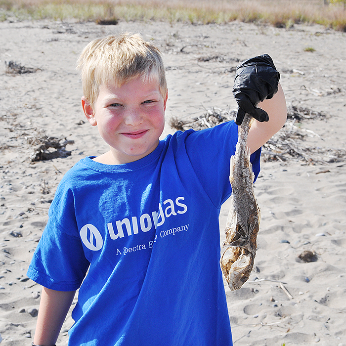 A young volunteer shows off his stinky, decaying find during the recent fourth annual Great Canadian Shoreline Cleanup.