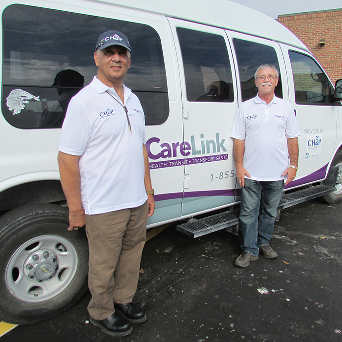 Larry Grineage, left, and Gary Blair, drivers with Family Services Kent, show off one of the two new vans the organization uses to help local residents get to and from medical appointments, procedures and treatments.
