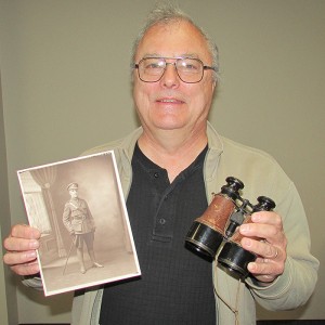 Geoff Hall shows off a photo of his late great-uncle Sonny Wilson, who died with a month to go in the First World War. Those are the field glasses that Sonny, an officer, used in the war.