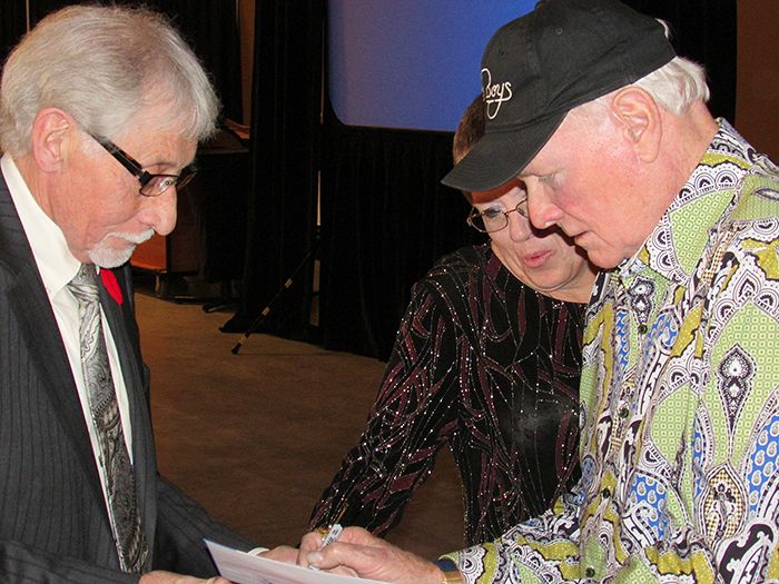 Mike Love of the Beach Boys signs autographs for fans at the 75th annual Rotary Banquet held at the John D. Bradley Centre Sunday night.