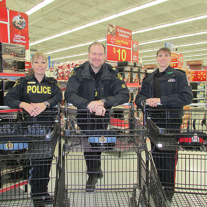 From left, Const. Janine Belanger, Sgt. Brian Knowler, and Const. Renee Cowell will be part of Shop with a Cop Dec. 20 where 30 kids from around Chatham-Kent will be Christmas shopping with 30 uniformed officers at Wal-Mart.