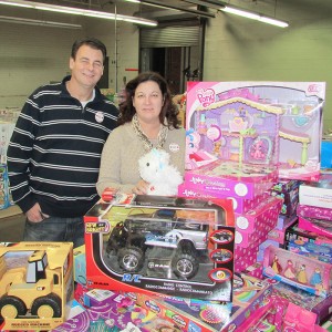 Tim Haskell and Rose Peseski of Chatham Goodfellows sort through some of the donated toys the group will be handing out to families in need this holiday season.