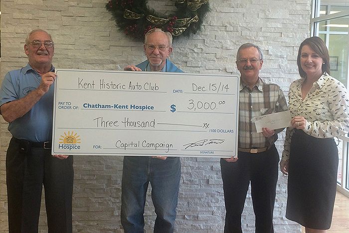 Kent Historic Auto Club members Len Langlois, Bob Filby and Brent Davis present a cheque for $3,000 to Jodi Maroney of the Chatham-Kent Hospice.