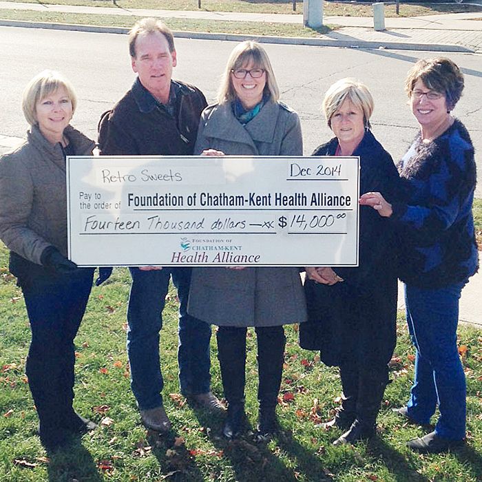 From left, Brenda Anderson, Gord Brodie, Dianne Millard, Barb Lather – members of the Retro Sweets organizing committee – donate a cheque for $14,000 to Barbara Noorenberghe, of the Foundation of CKHA.