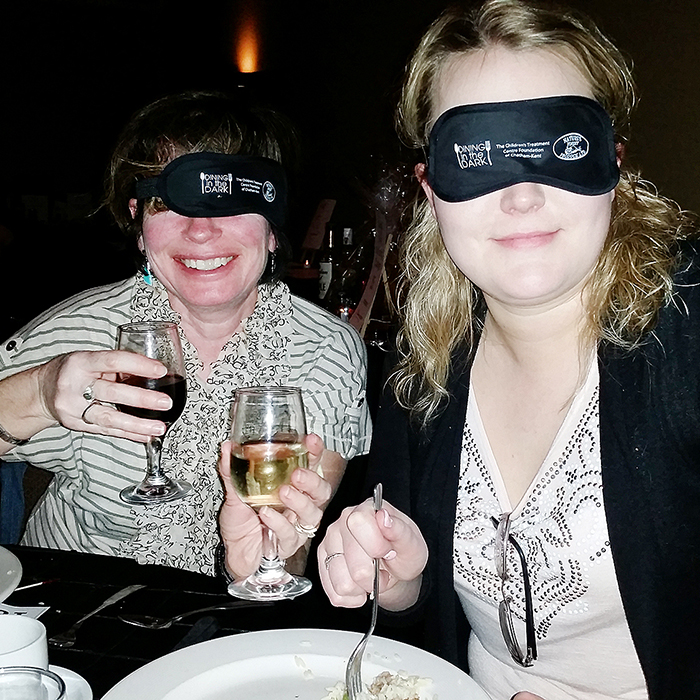 Natalie Robert of Chatham, right, and Colleen King of Pain Court enjoyed their sensory deprivation while at the Children’s Treatment Centre Foundation of Chatham-Kent Dining in the Dark fundraiser Thursday evening at Aristo’s Banquet Room in Chatham. Almost $7,000 was raised to purchase therapy equipment and service enhancements for children with sensory challenges.
