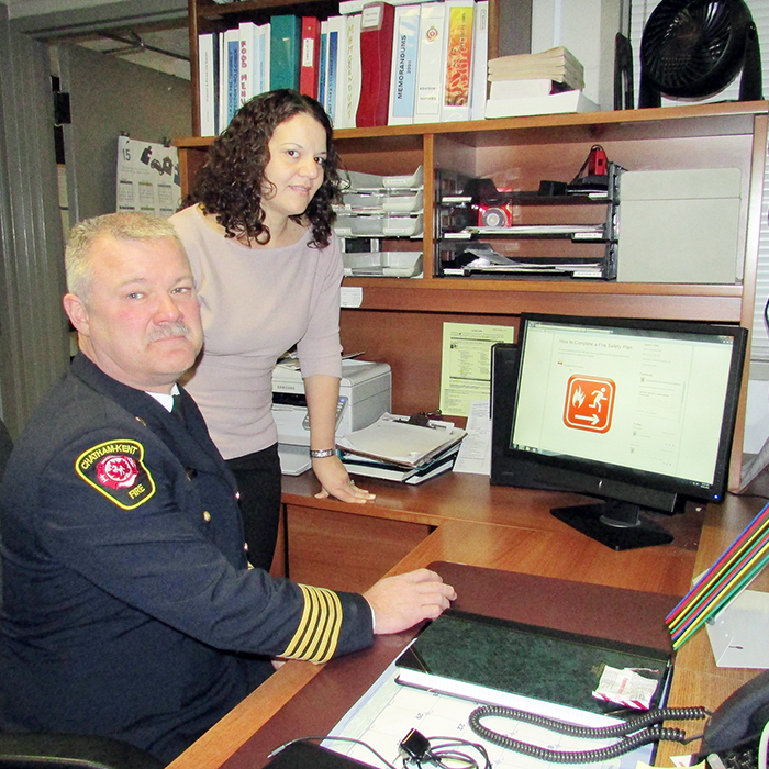 Union Gas’ Diane Pisani and Chatham-Kent Fire Chief Ken Stuebing look over the ckfire.com website Thursday. Union Gas donated $5,000 to help revamp the site.