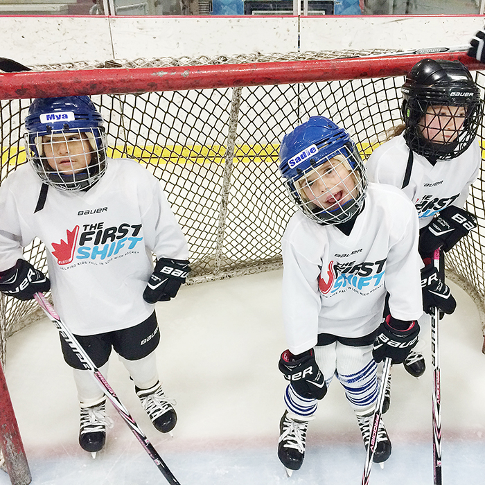 Mya Summers, Sadie Bear and Ava Meriano hang out in the net during a break in the First Shift program in Chatham. Kent minor hockey officials say the program is a huge success, as do the parents.