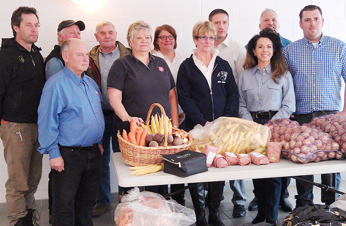Local agricultural organizations donated to the local food banks today as part of Food Freedom Day. Back row, from left, Joe Grootenboer, River Bell Market Garden; Jacques Tetreault, Chatham-Kent Essex Christian Farmers; Joe Vanek, Grain Farmers of CK District 2; Capt. Stephanie Watkinson of the Salvation Army; Bob Daniels of Farm Credit Canada; and Mike Buis, Kent Cattlemen's Association. Front row, Louis Roesch, Kent Federation of Agriculture; Rhonda Dickson of the Salvation Army; Brenda LeClair, Outreach for Hunger, MaryAnne Udvari, Kent Federation of Agriculture; and Adam Stallaert, Kent Federation of Agriculture.