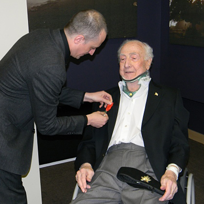 Consul General of France in Vancouver Jean-Christophe Fleury pins the Legion of Honour medal on Tsawwassen's Lock Laurie Friday, Jan. 30 at a ceremony at Delta Hospital.   Photograph By Dave Willis of the Delta Optimist