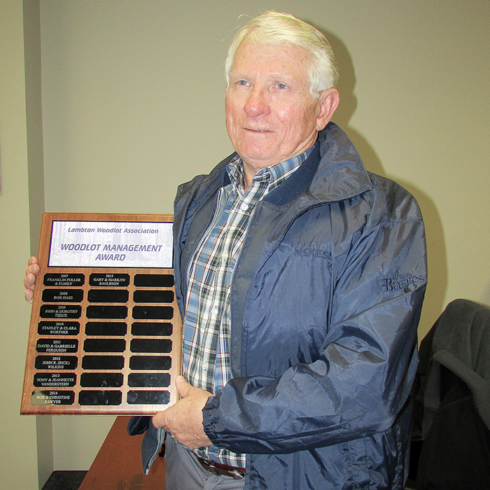 Gary Eagleson shows off the plaque he and his wife Marilyn received recently for their work with their woodlot property near Florence. The couple won the 2015 woodlot management award from the Lambton Woodlot Owners’ Association.