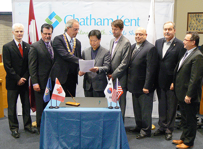 Taking part in Tuesday’s official signing ceremony for the new North Kent wind farm project are, from left, the Municipality of Chatham-Kent’s Chief Legal Officer John Norton, Entegrus President and CEO Jim Hogan, Mayor Randy Hope, Samsung Vice President of Project Development Jeongtack Lee, Pattern Energy Vice President of Business Development Colin Edwards, North Kent Coun. Leon Leclair, North Kent Coun. Joe Faas, and municipal CAO Don Shropshire.