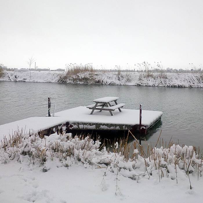 Tuesday morning's fresh blanket of snow covers a dock on Running Creek in Wallaceburg.