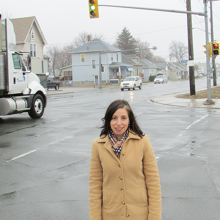 CAA’s Caroline Grech stands at the corner of Lacroix and Richmond streets in Chatham. Both streets are trending in the CAA’s annual Worst Roads voting.