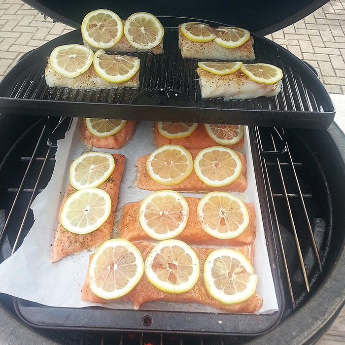 Lemon slices adorn salmon and cod on Bruce's Big Green Egg. Yes, it was delicious.