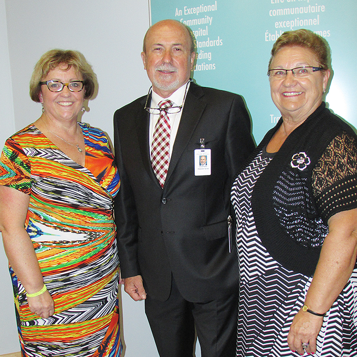 Brenda Richardson, CKHA board chair, celebrates with CEO Colin Patey and St. Joseph Health Services chair Gail Rumble at the announcement recently of a voluntary merging of the two boards into one entity.