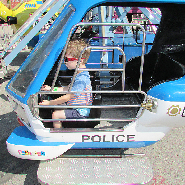 Connor Goulet, 3, from Essex was very serious about riding in the Carter Shows police helicopter as he spent the morning Thursday with Grandma at CherryFest.