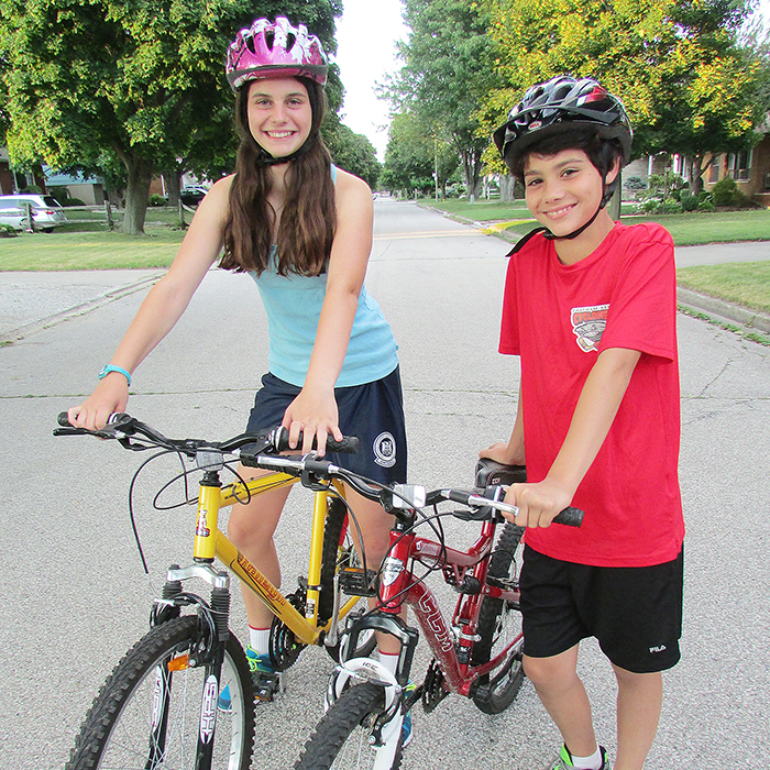 Diana and Anthony Lucarelli don’t leave home without their bike helmets. If police spot kids such as the Lucarellis this summer, they may very well get pulled over and ticketed ... for a free ice cream at McDonald’s.