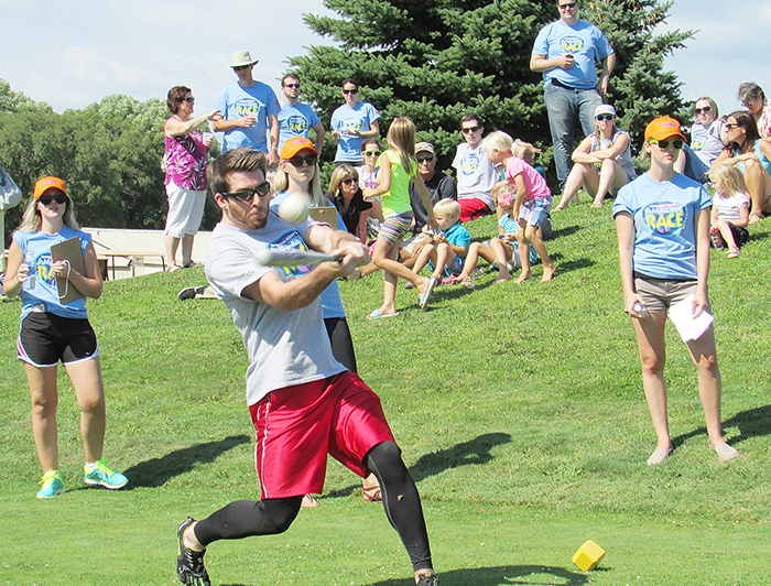 Trevor Nethery of Team Phoenix smashes one down the fairway Saturday as part of the final stage of the United Way’s Amazing Race. Nethery and teammate Dan Peltier finished second. The KGB Reunion Tour took top spot.