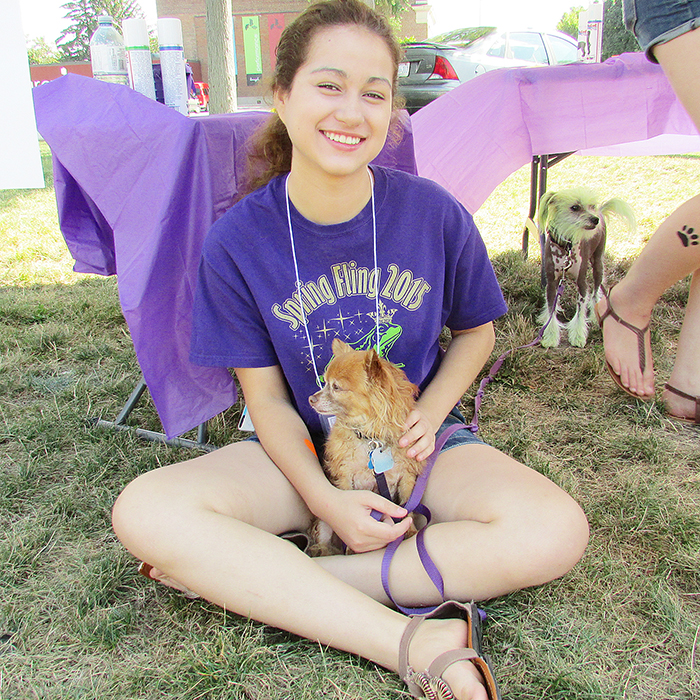 Yadell Innes of Chatham hangs out in the shade with Izzy during Dog Lovers Days 2015