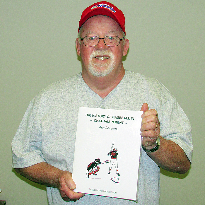 Fred Osmon with a copy of his latest book, “A History of Baseball in Chatham 'N’ Kent.”