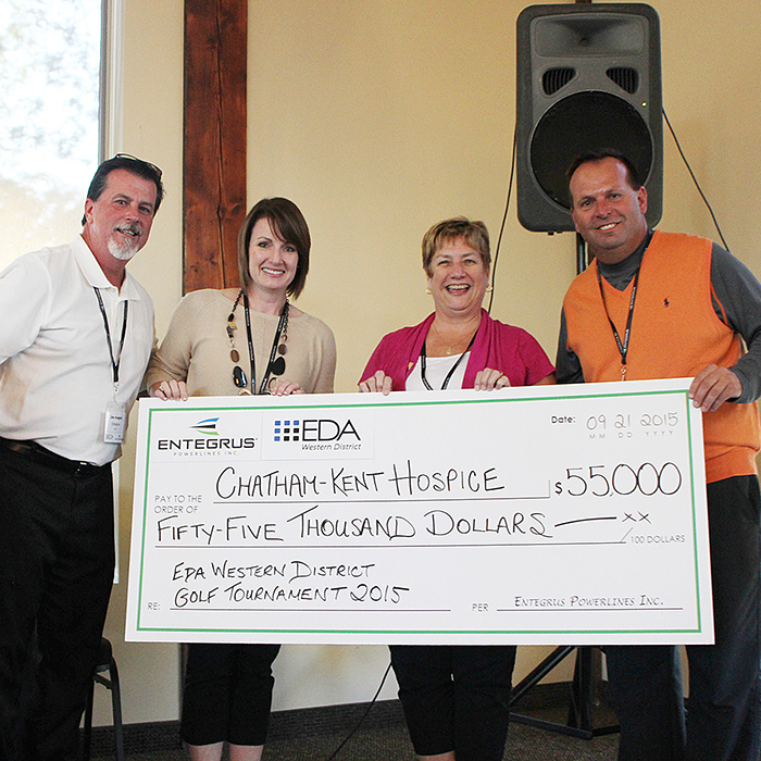 Jim Hogan, left, president and CEO of Entegrus, and Ray Tracey, chair of the Electricity Distributors’ Association, right, hand over a cheque for $55,000 to Chatham-Kent Hospice representatives Jody Maroney and Michelle O’Rourke.