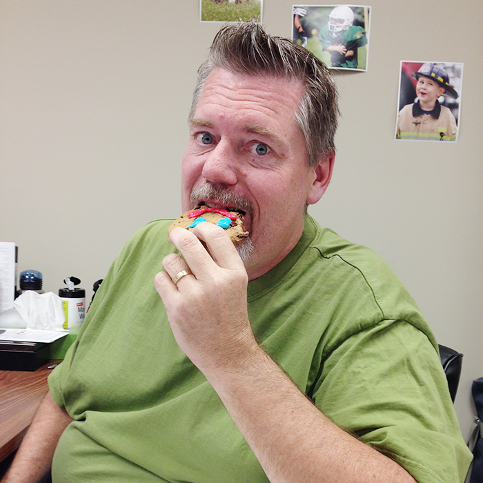 The Chatham Voice's Bruce Corcoran bites into a Smile Cookie. Staff at The Voice nibbled on the cookies this week in support of the Children's Treatment Centre of Chatham-Kent.