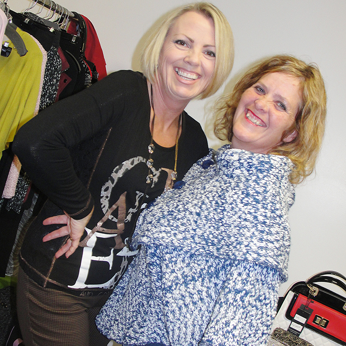 Two of Patricia M. Productions "family members" ham it up at a recent fashion show in Chatham. Through the years, the shows have raised more than $50,000 for local charities. Just as importantly, they have raised community awareness for those charities.