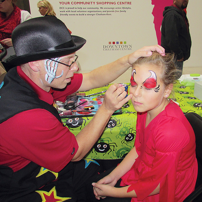 Louie the Clown puts the finishing touches on some devilish details on Cassandra Middleton, 10, at Downtown Chatham Centre’s Malloween event on Saturday. It just so happened that Cassandra stopped by the Corcorans on Halloween night too.