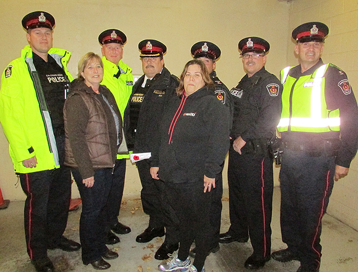 MADD and the Chatham-Kent Police Service teamed up to kick off the Red Ribbon Campaign and RIDE season, and also to acknowledge National Road Crash Victims’ Awareness Day Nov. 18. Pictured, in front are MADD C-K community leaders Heather Bakker and Janine Carr. Back, from left, are C-K police officers Mike Pearce, Mike Currie, Deputy Chief Jeff Littlewood, Paul Dias, Shawn Mungar and Kent Muir.